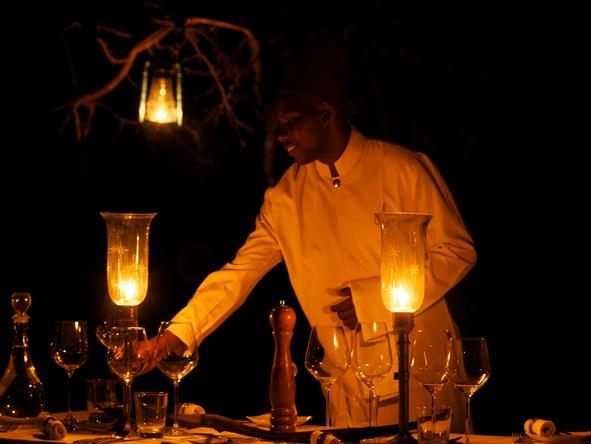 Amara Selous - waiter laying table